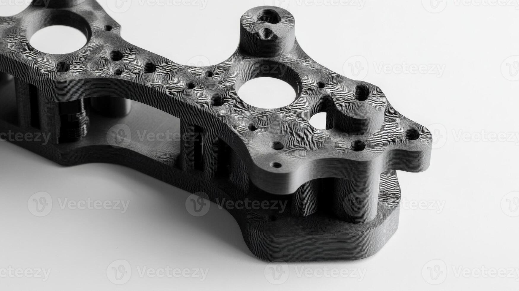 A detailed view of a custom 3Dprinted gimbal bracket featuring complex geometries that provide stability while maintaining minimal weight with visible layering that emphasizes the additiv photo