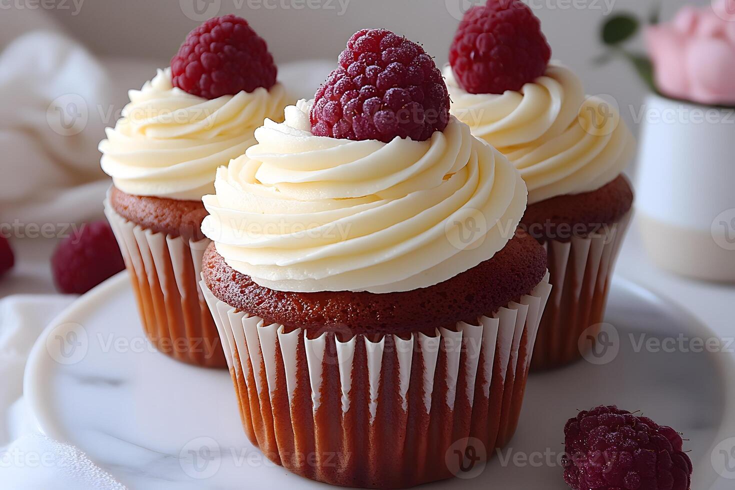 Raspberry-Topped Vanilla Cupcakes for Elegant Dessert Presentation photo