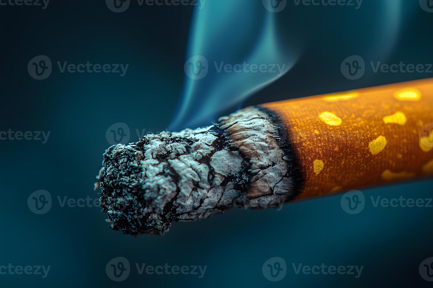 Close-up of a Smoldering Cigarette Emitting Smoke in Dark Atmosphere photo