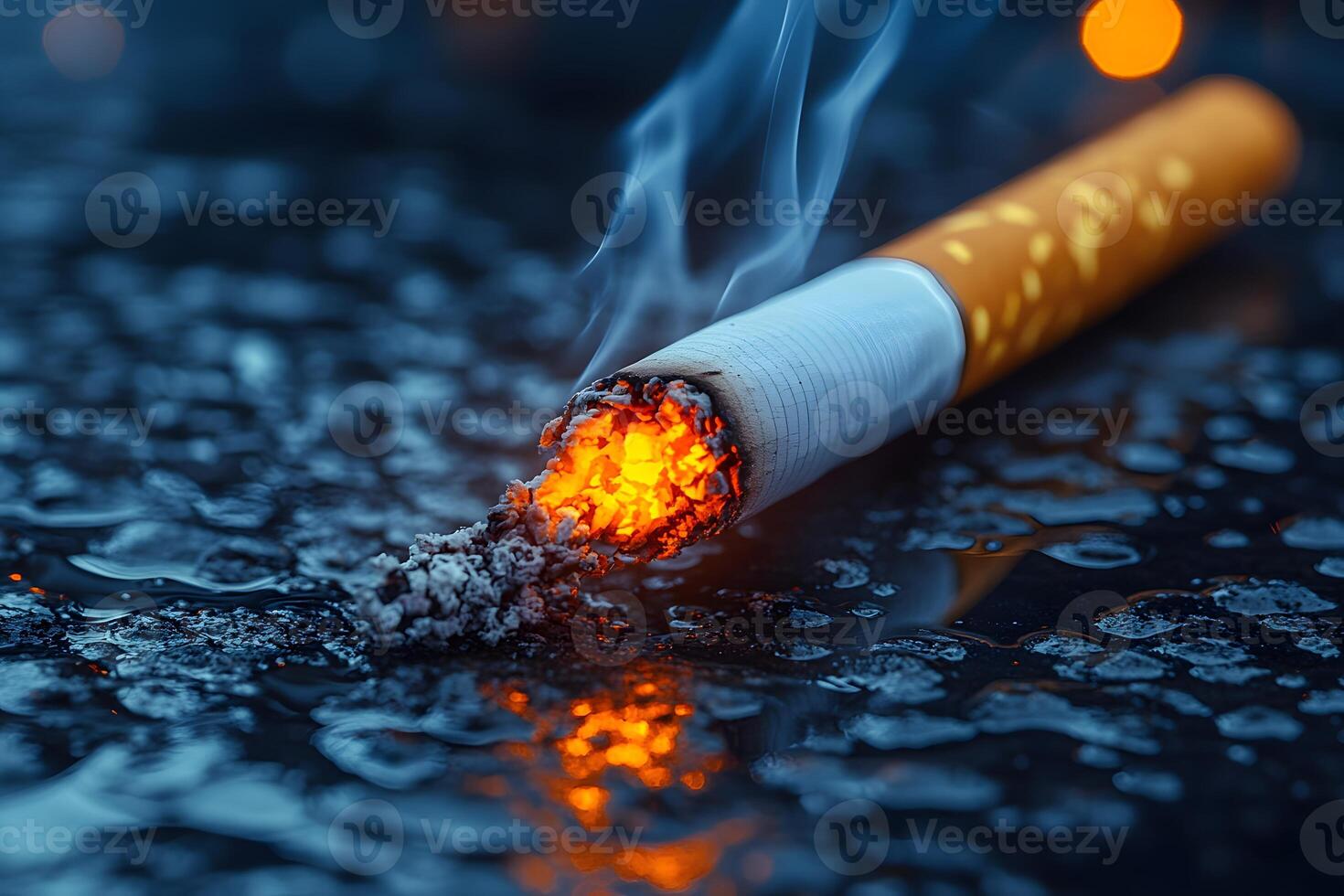 Burning Cigarette on Wet Surface - Smoking Consequences Concept for Health Awareness photo