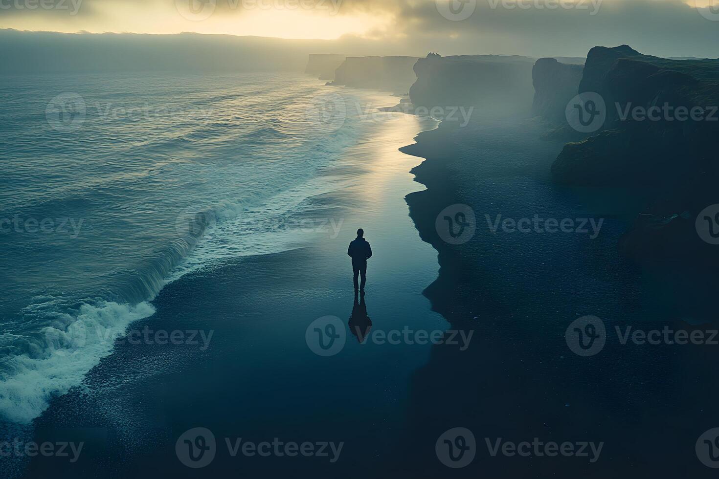 Solitude at Dusk Lone Figure on Misty Beach Overlooking Ocean Waves photo