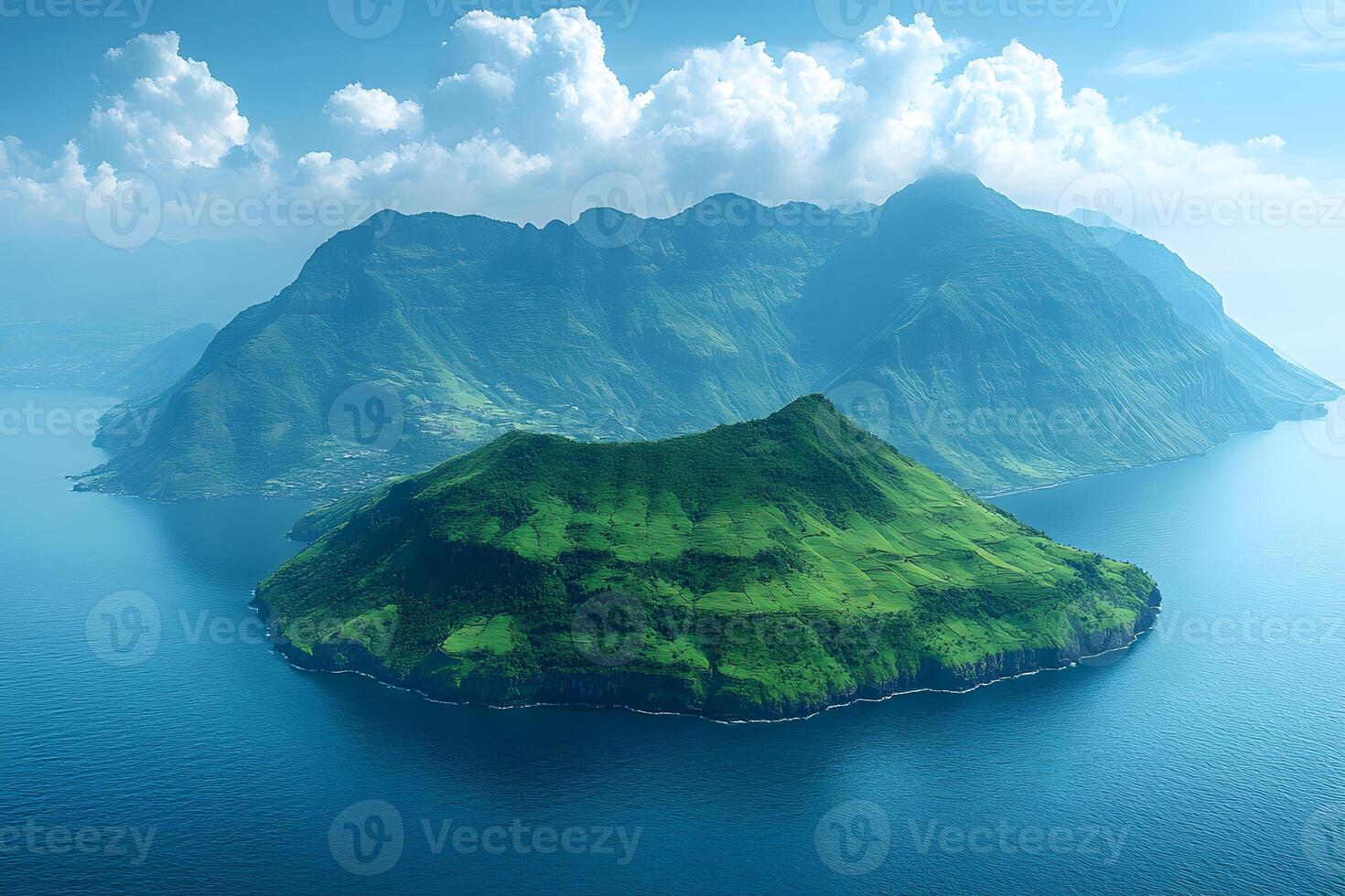 Majestic Green Island and Mountain Range Surrounded by Ocean photo
