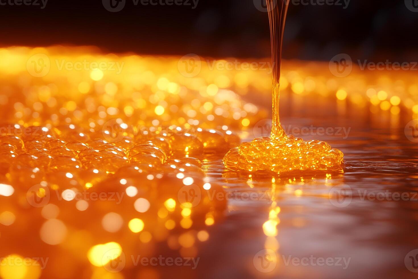 Golden Honey Flowing and Bubbling in Warm Ambient Lighting for Creative Design photo