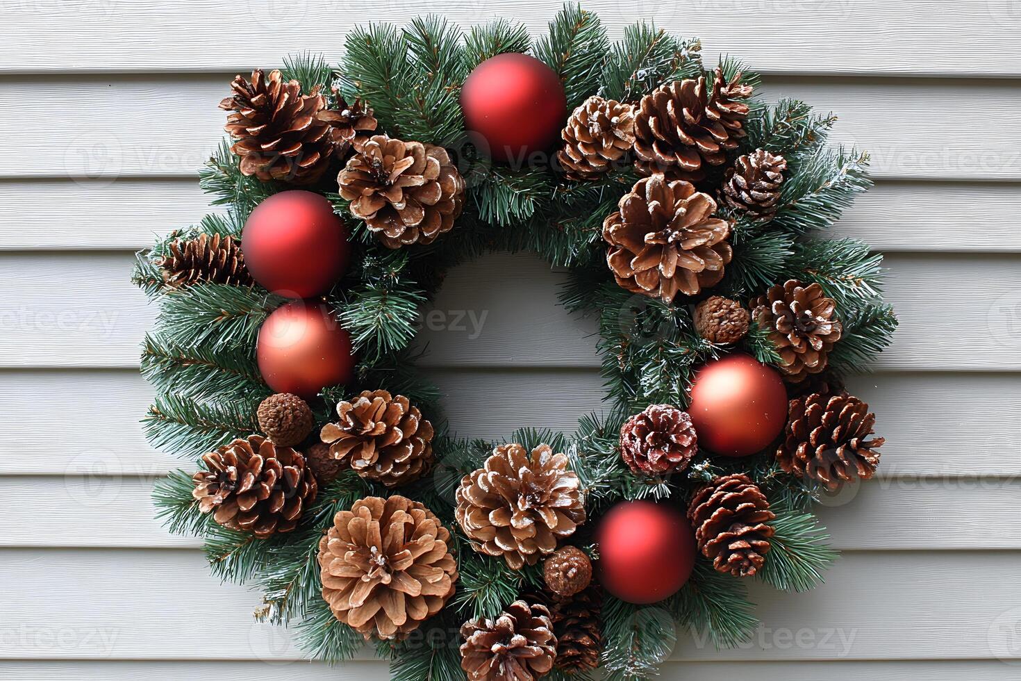 Festive Holiday Wreath with Pine Cones and Red Ornaments for Seasonal Decoration photo