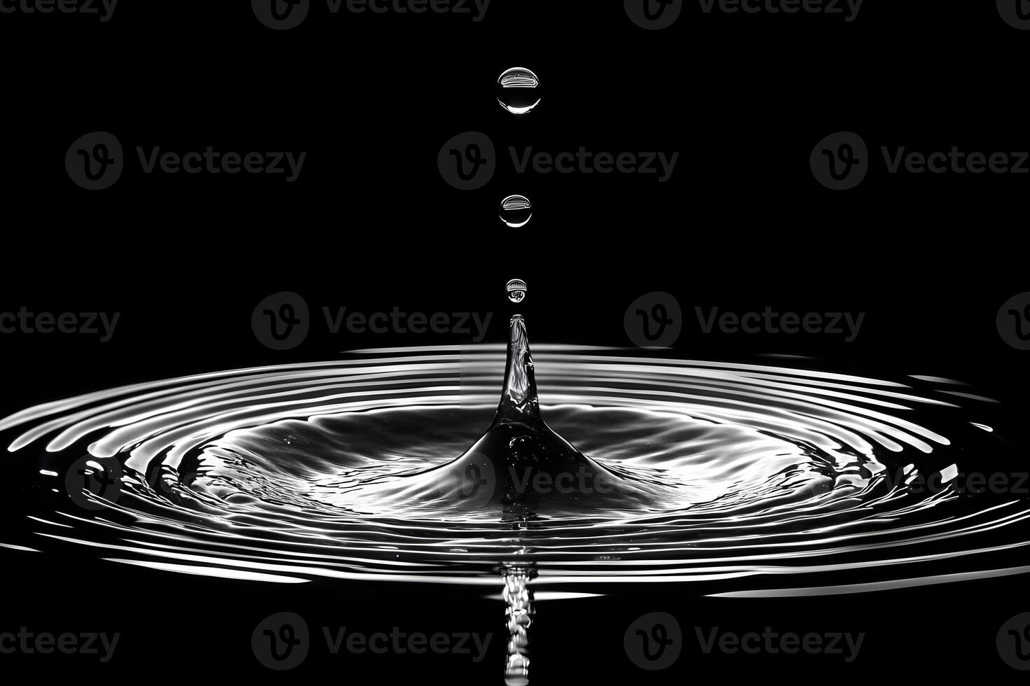 Water Droplet Impact with Ripples on Black Background Abstract Art and Design Inspiration photo