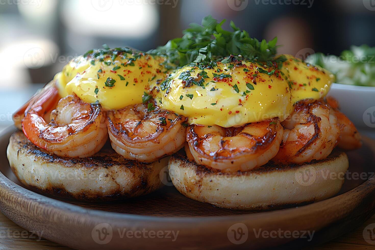 Gourmet Shrimp Benedict with Hollandaise Sauce on English Muffins for Brunch photo
