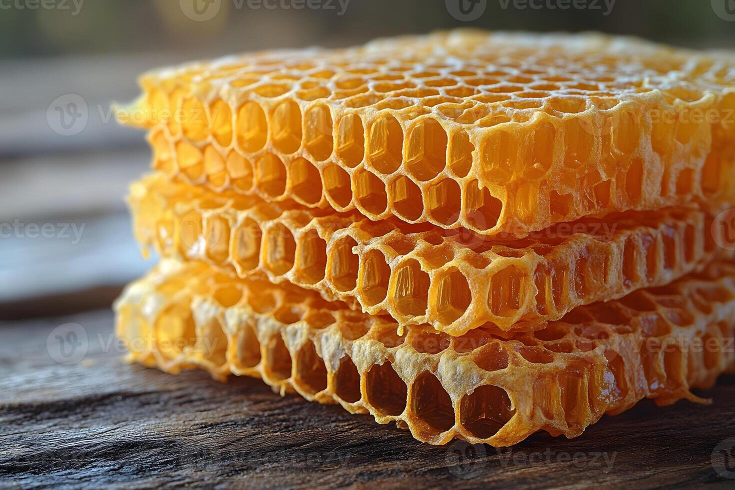 Close-Up of Honeycomb on Rustic Wood Surface for Nature-Themed Designs photo