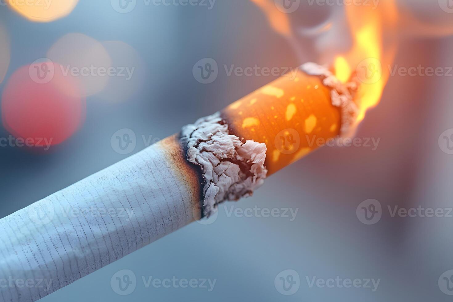 Close-Up of a Burning Cigarette with Glowing Ember for Health Awareness Campaigns photo