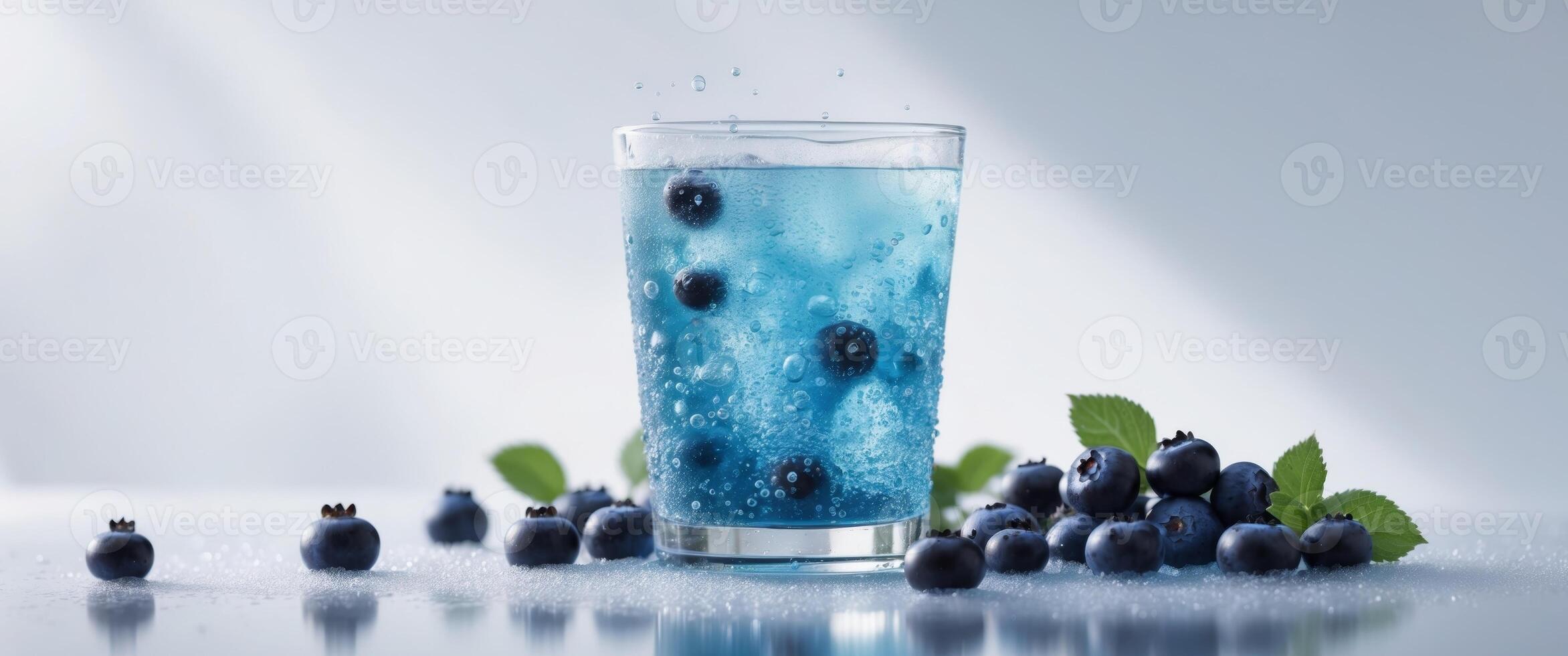 Refreshing icy blueberry beverage with fresh berries and bubbles photo