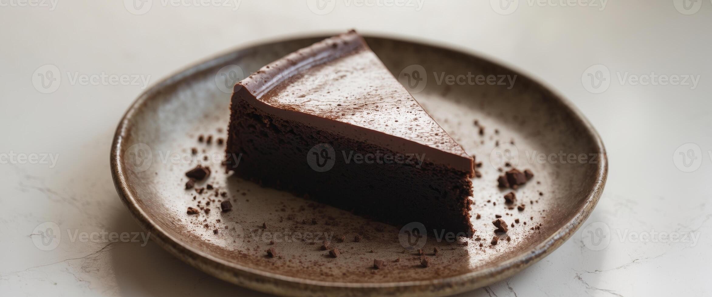 Rich Chocolate Cake Slice on Rustic Plate with Crumbs photo