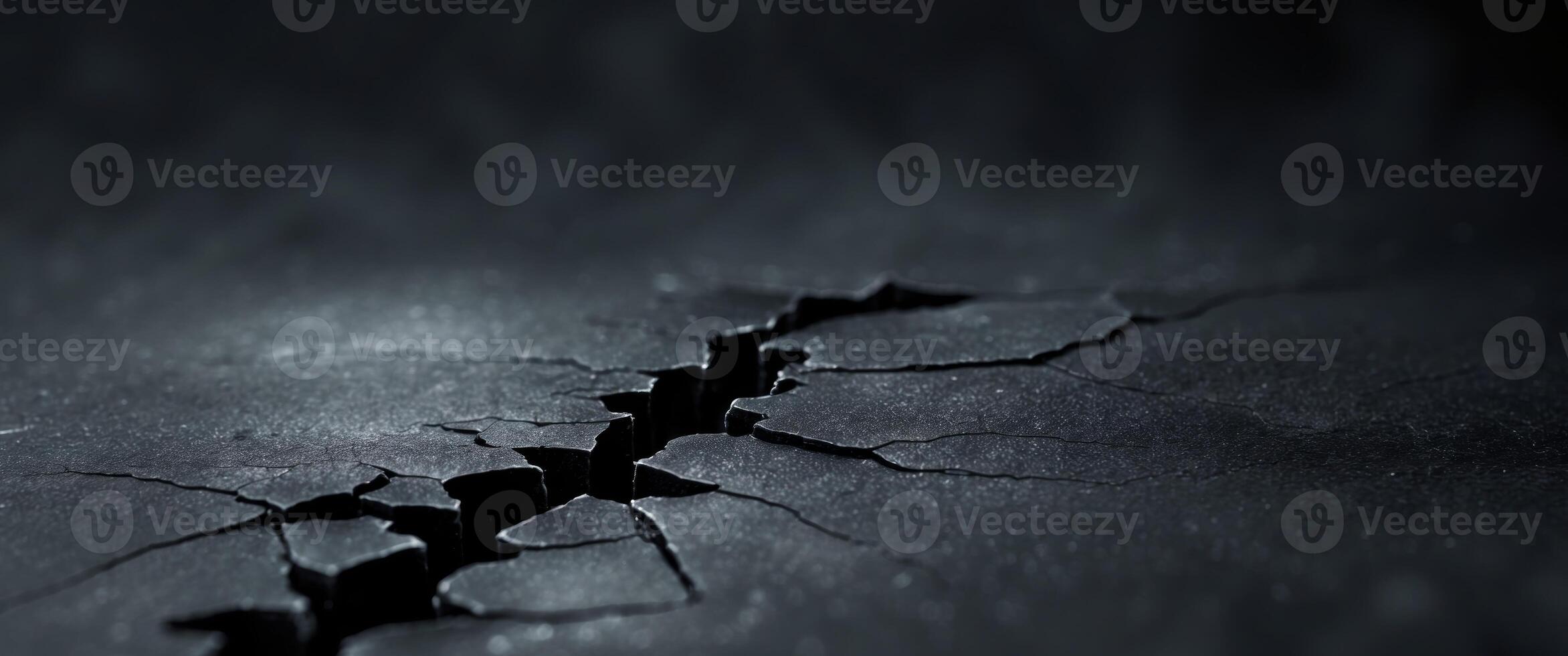 Black background with a central crack creating a dramatic visual effect. photo