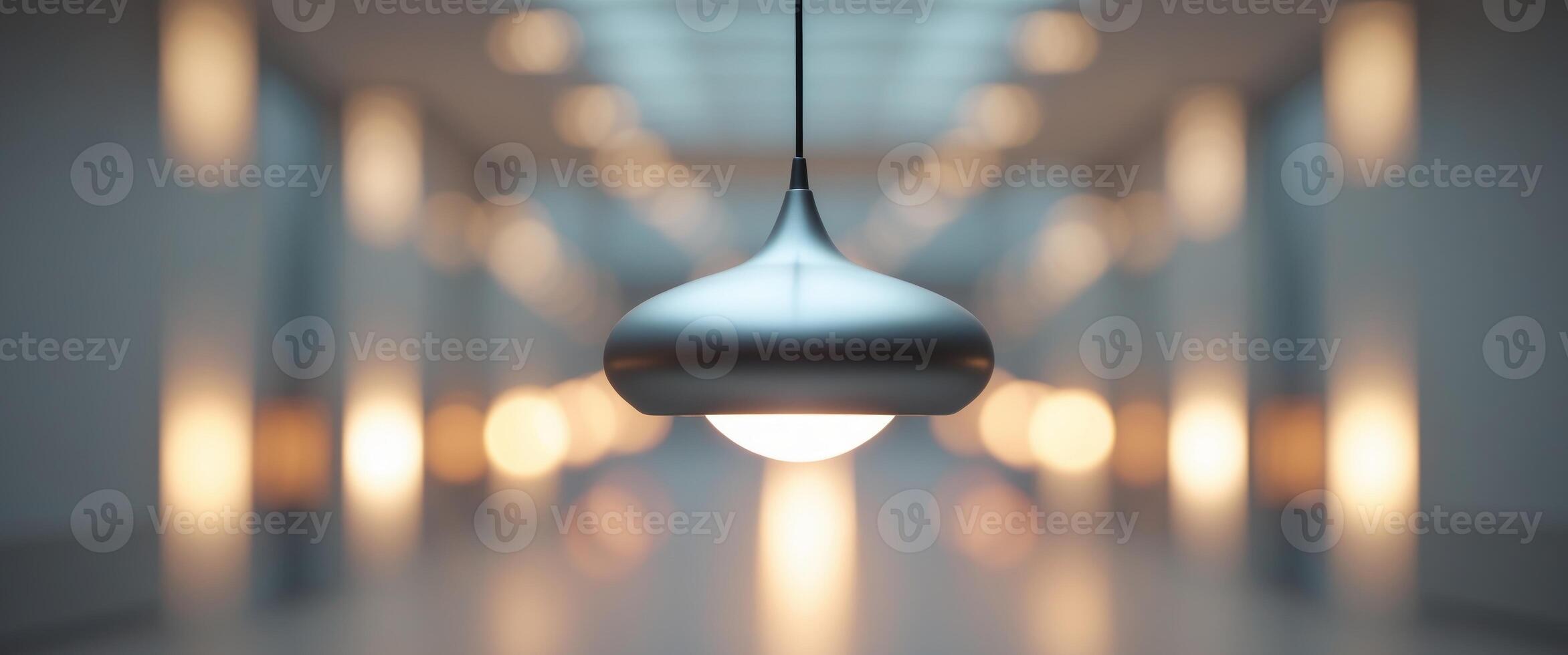 Lit pendant lamp in hallway with blurred background lights. photo