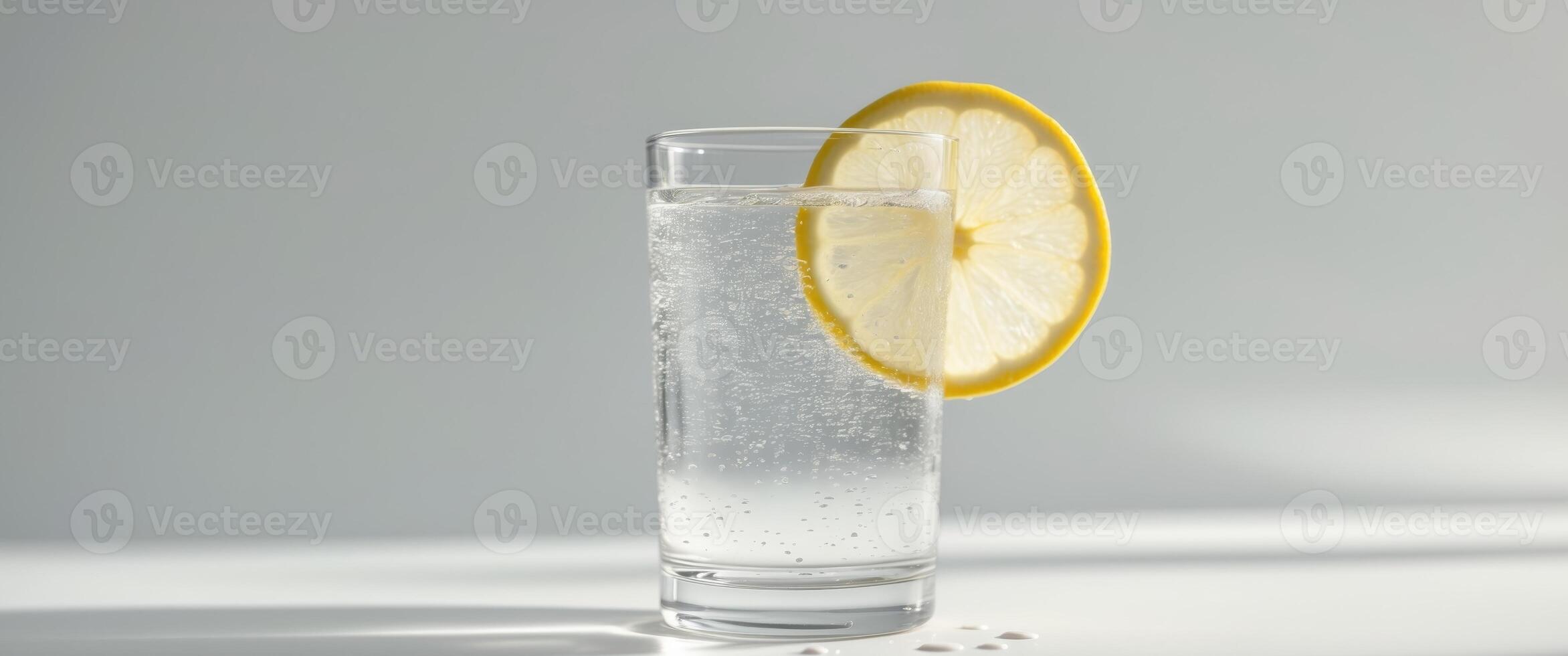 Refreshing Sparkling Water with Lemon Slice. photo