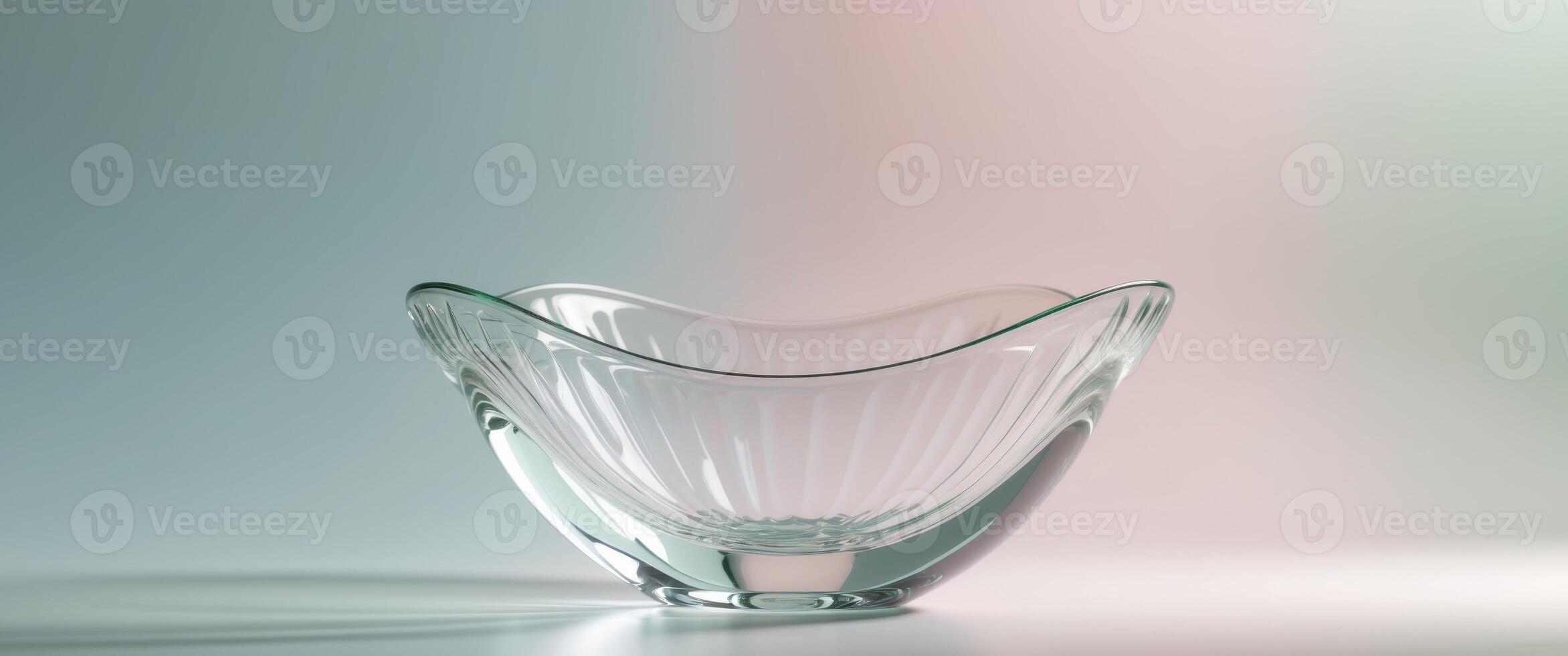 Elegant Glass Bowl on Glossy Surface with Soft Pastel Background. photo