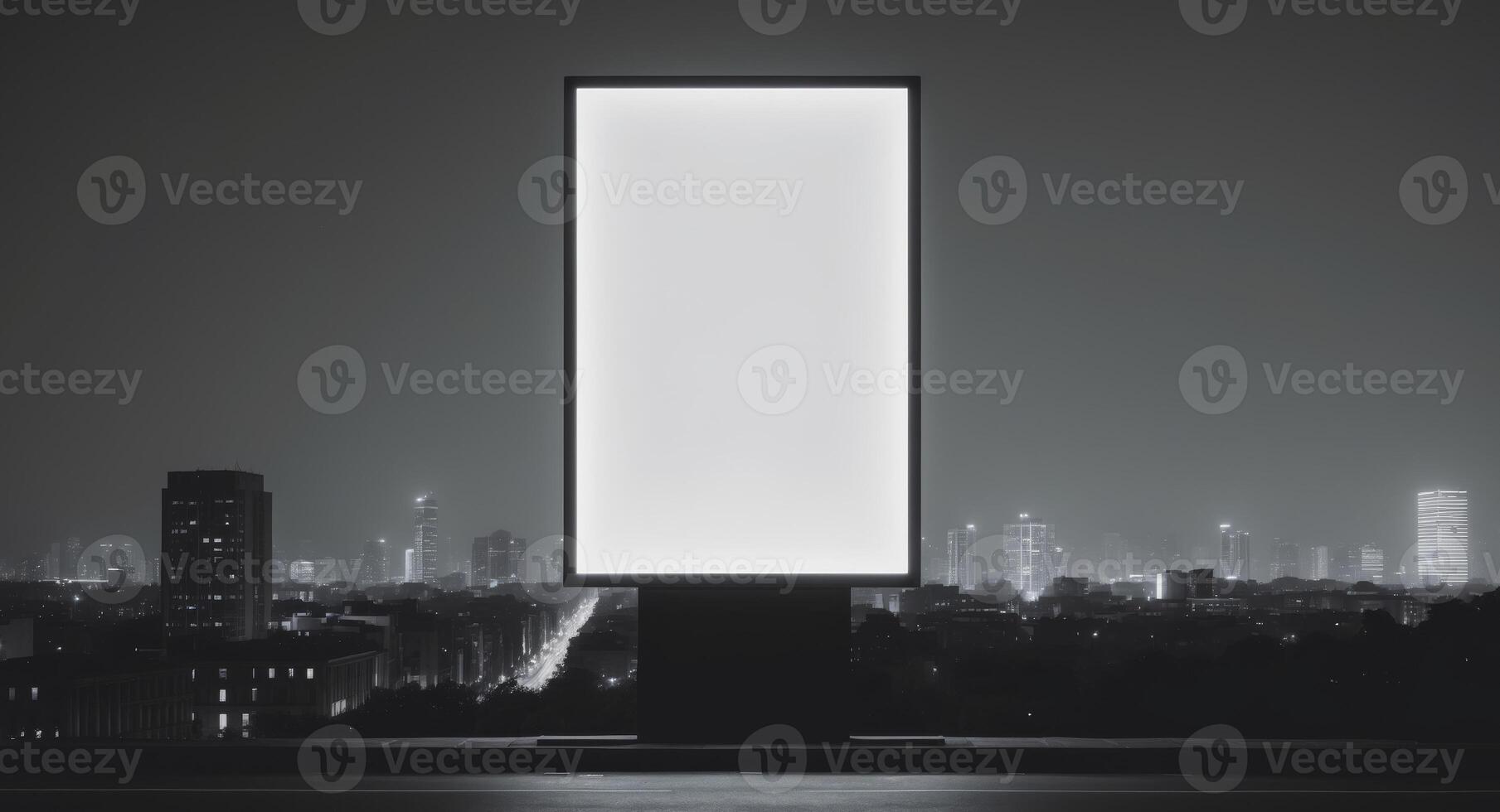 Illuminated blank billboard in urban night setting photo