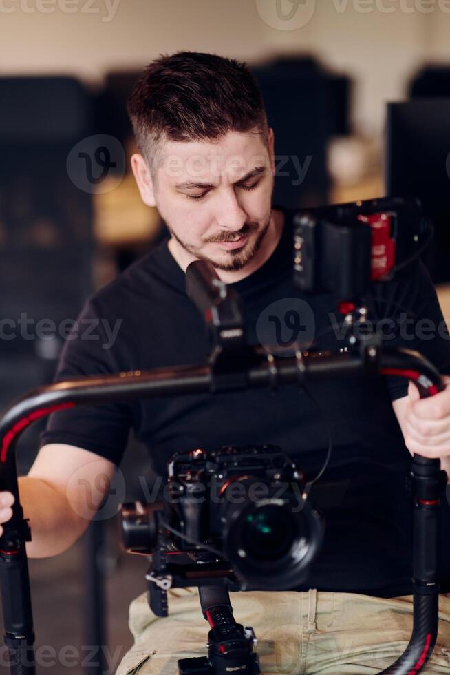 A professional videographer using modern equipment to capture compelling visuals, showcasing expertise and creativity in the art of production. photo