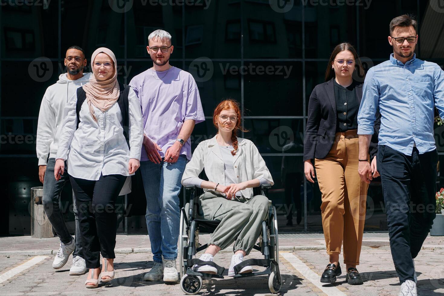 A diverse and confident group of businessmen posing together, with a businesswoman in a wheelchair radiating success, ambition, and unity, capturing the essence of a dynamic and inspiring business photo
