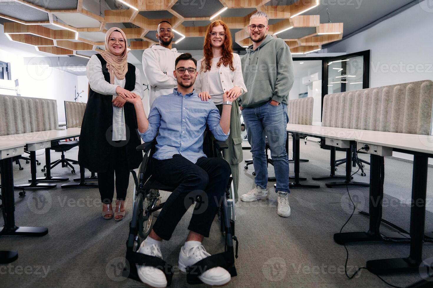 Young businessmen in a modern office extend a handshake to their business colleague in a wheelchair, showcasing inclusivity, support, and unity in the corporate environment. photo