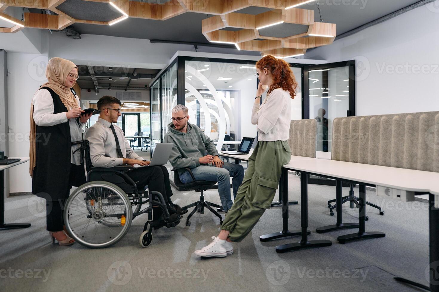 Young group of business people brainstorming together in a startup space, discussing business projects, investments, and solving challenges photo