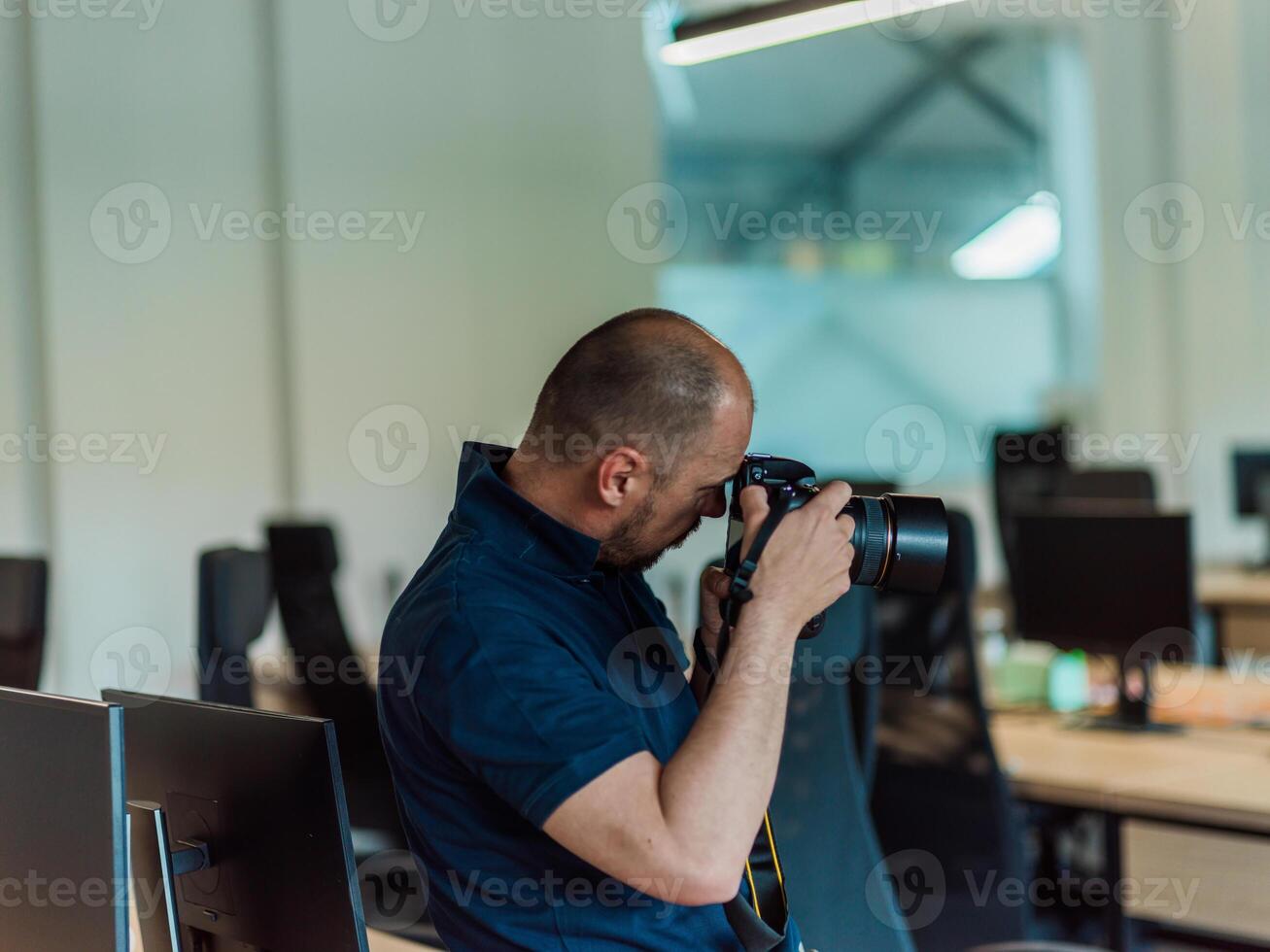 A photographer skillfully captures the essence of corporate life, focusing on business professionals in a modern office setting, exemplifying the dynamic interactions and diverse collaboration within photo