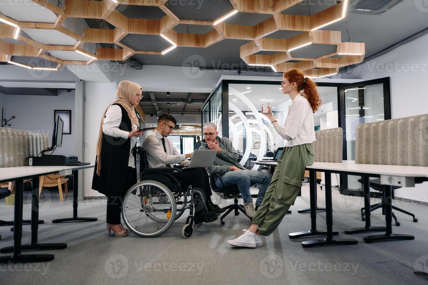 Young group of business people brainstorming together in a startup space, discussing business projects, investments, and solving challenges photo