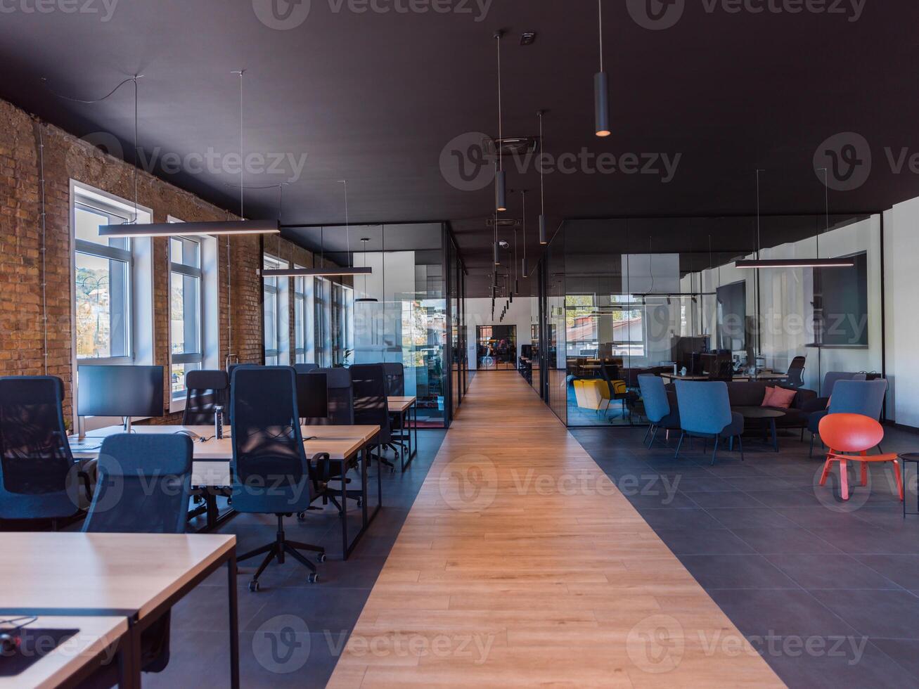 In a setting of modern, glass-walled business startup offices, the open, airy workspace reflects a contemporary and innovative ambiance, promising a dynamic environment for entrepreneurial growth photo