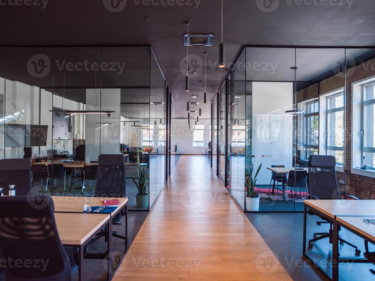In a setting of modern, glass-walled business startup offices, the open, airy workspace reflects a contemporary and innovative ambiance, promising a dynamic environment for entrepreneurial growth photo
