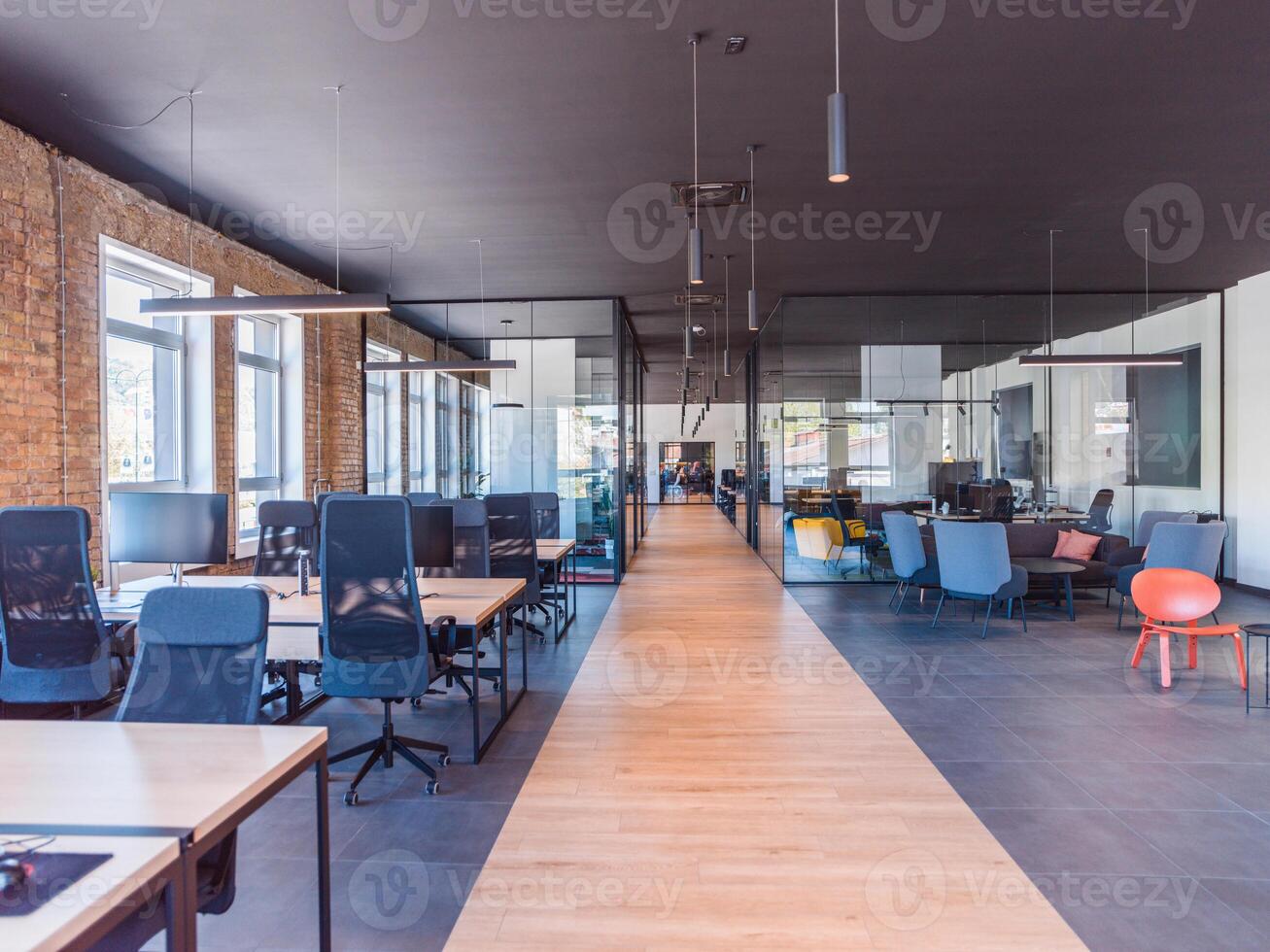 In a setting of modern, glass-walled business startup offices, the open, airy workspace reflects a contemporary and innovative ambiance, promising a dynamic environment for entrepreneurial growth photo