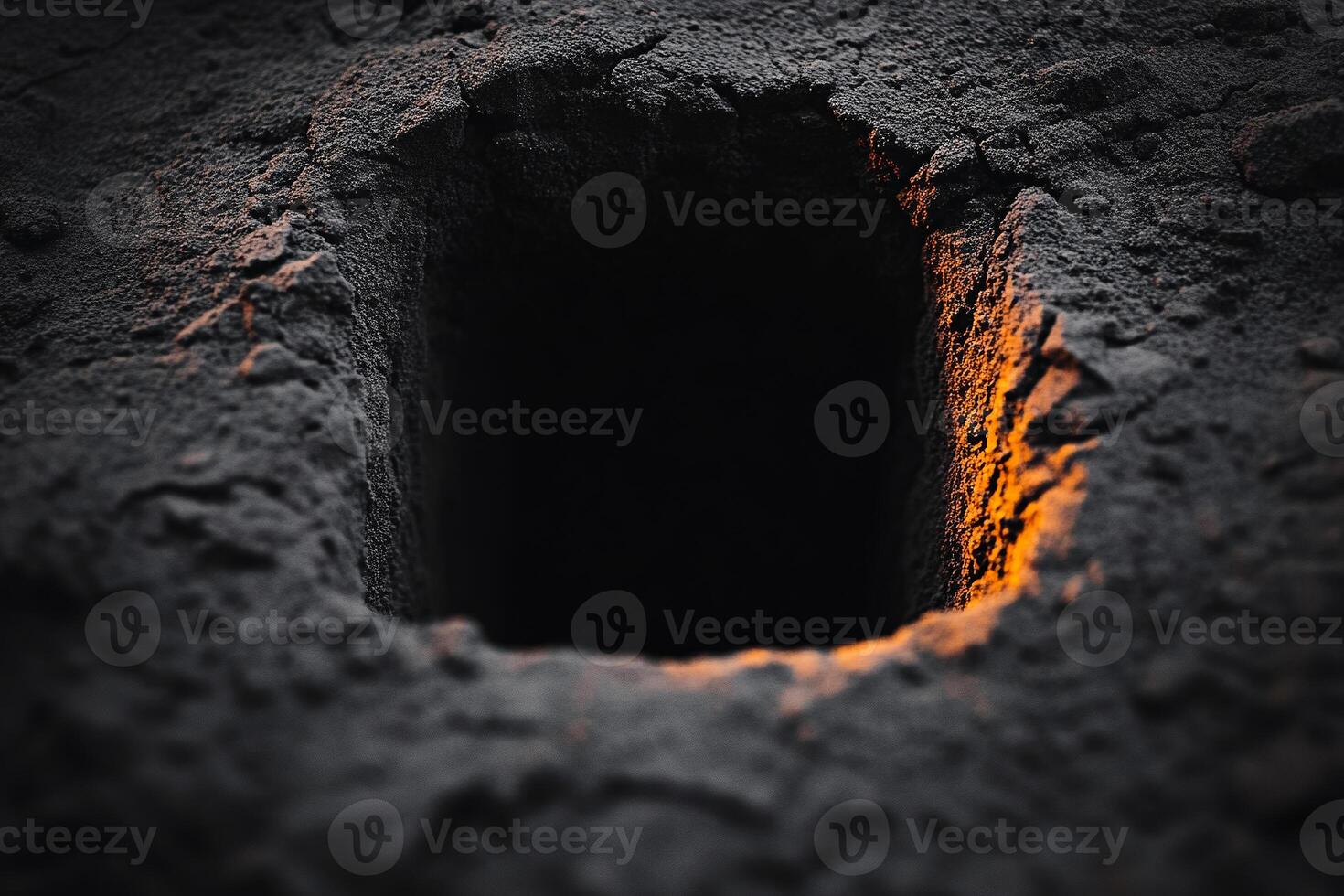 Grave in the ground with a light coming in it photo