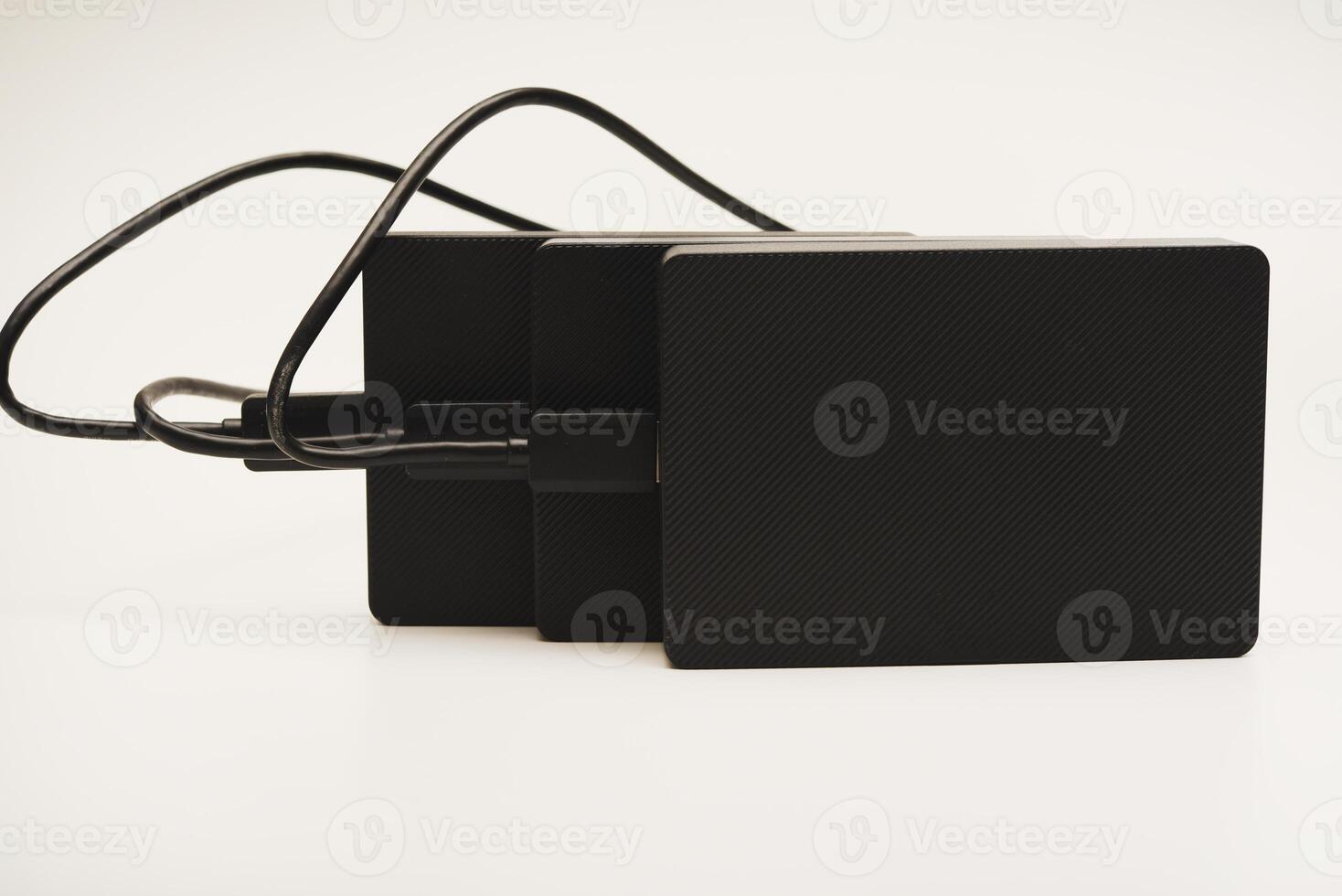 Modern data storage devices with USB wires.Hard drives. photo