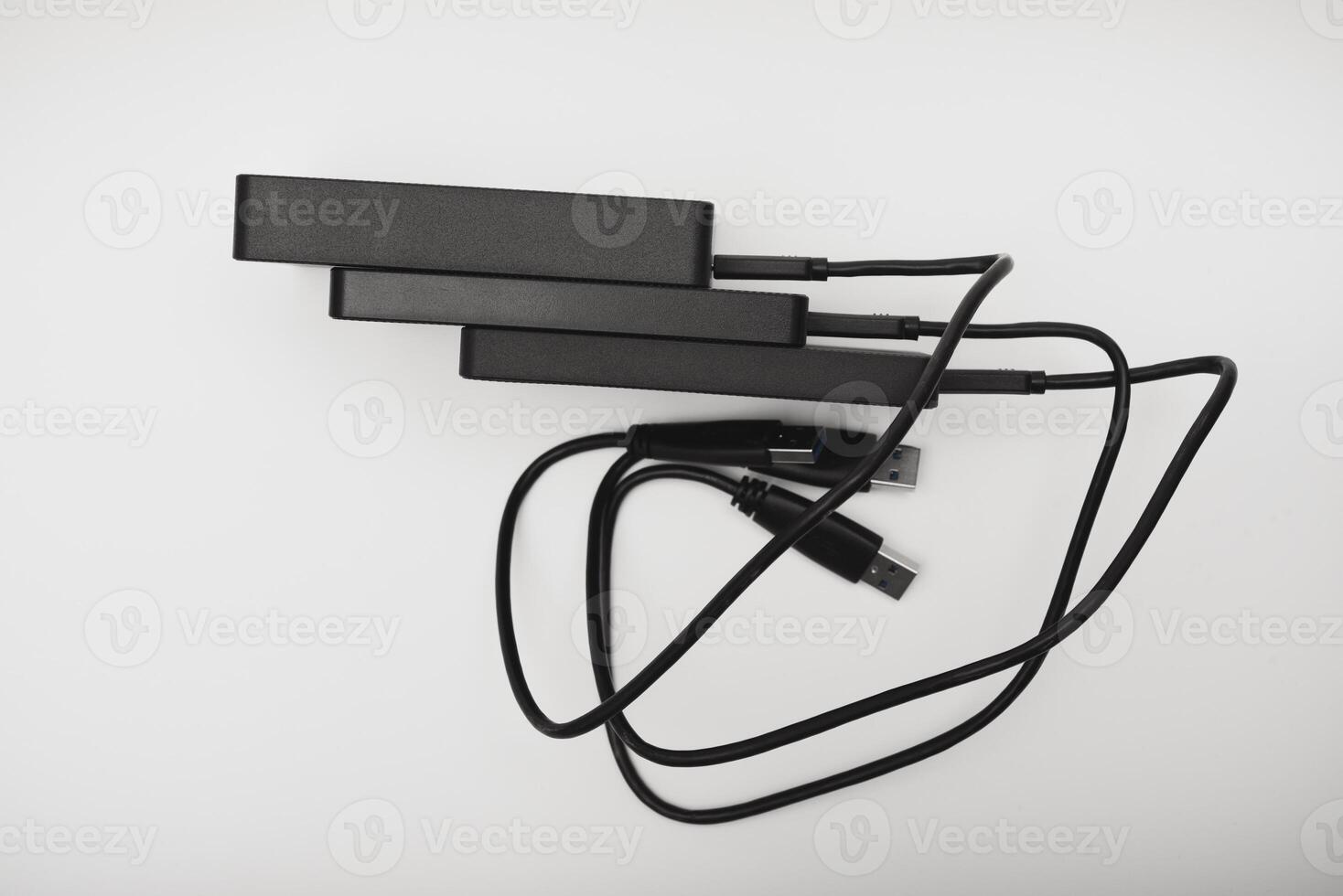 Hard drives on a white background. Modern data storage devices photo