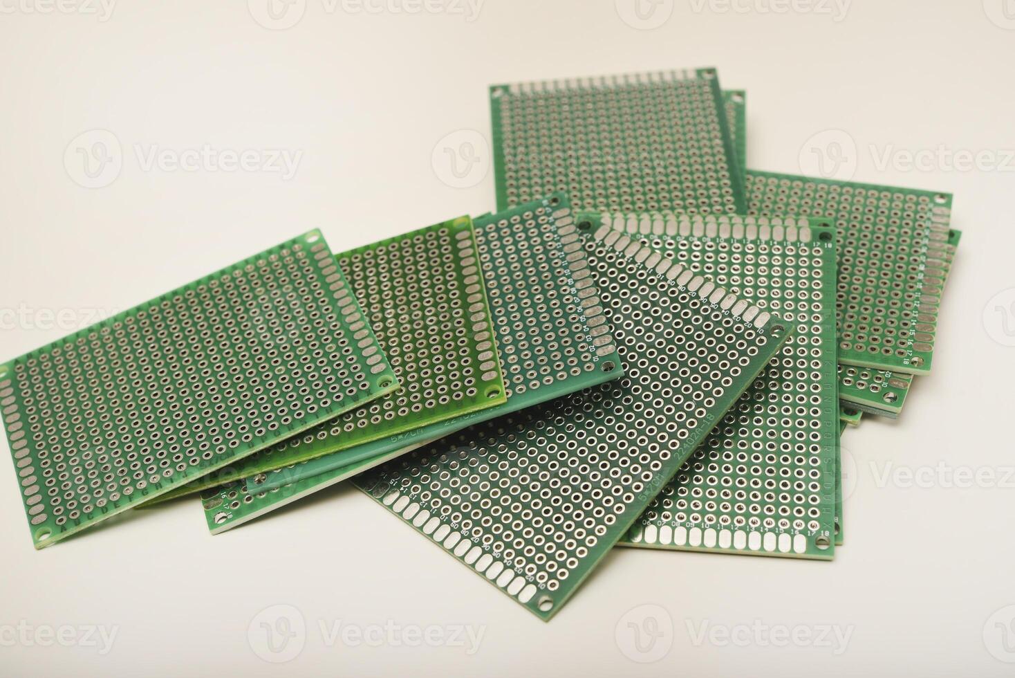 A green breadboard for electronics. The printed circuit board. photo