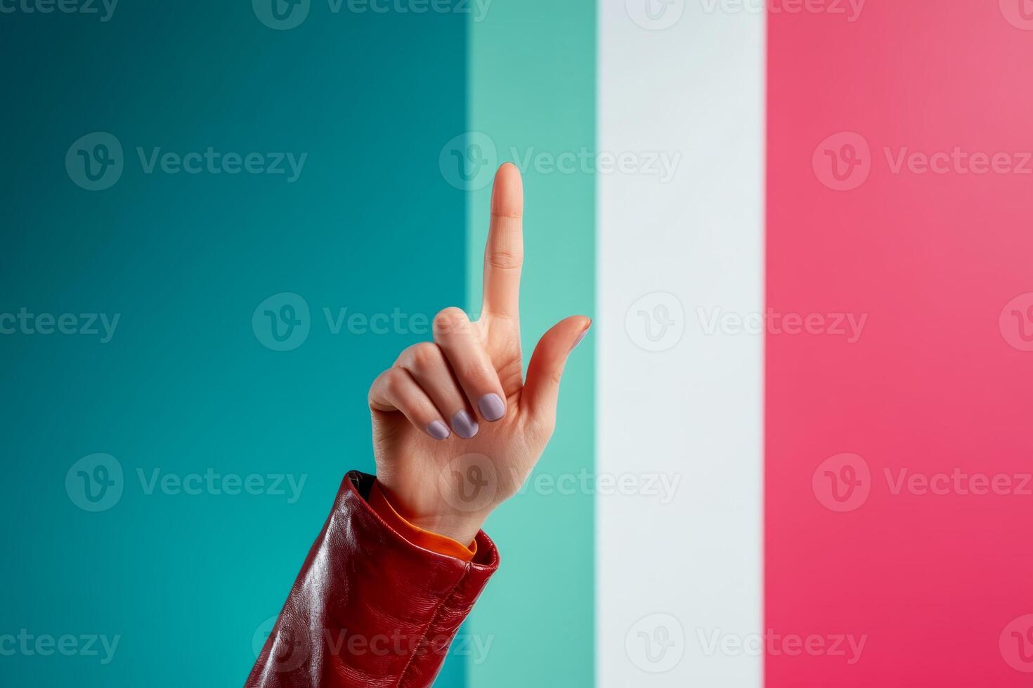 Hand gesture against colorful backdrop representing culture and identity photo