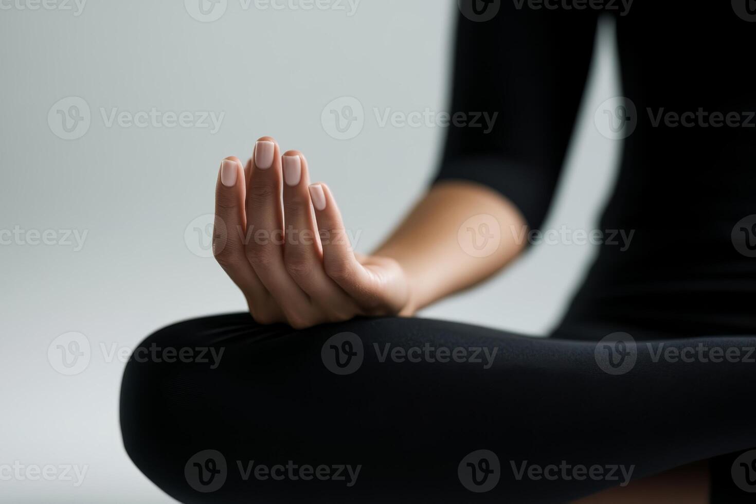 Mindful meditation practice in a serene environment with a focused hand gesture at sunset photo