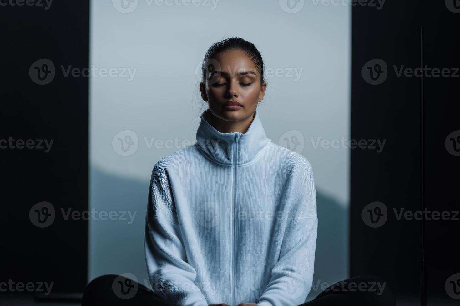 Mindful meditation practice in a serene and minimalistic indoor setting during early morning hours photo