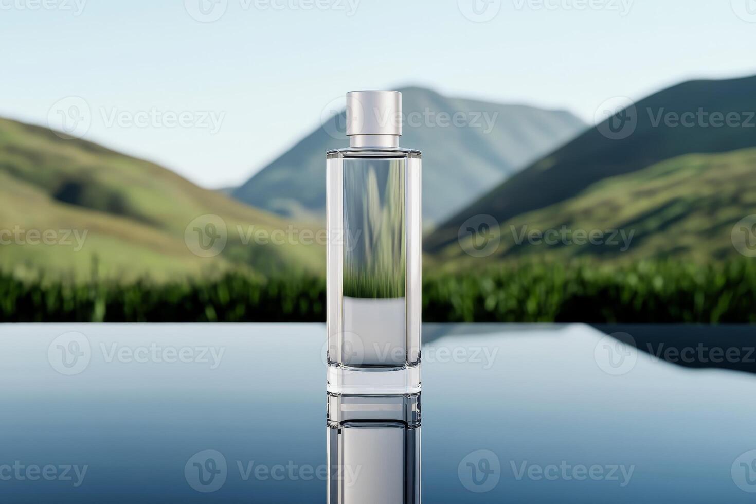 Clear glass bottle reflecting nature amidst rolling green hills and mountains during daylight photo