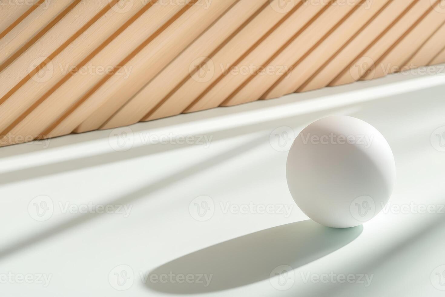Minimalist composition featuring a white spherical object positioned on a pastel surface with geometric shadows photo