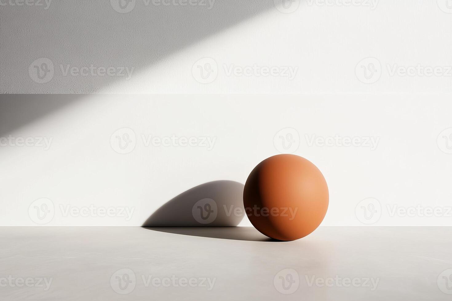 Spherical terracotta object casting a shadow on a minimalist background during daylight photo
