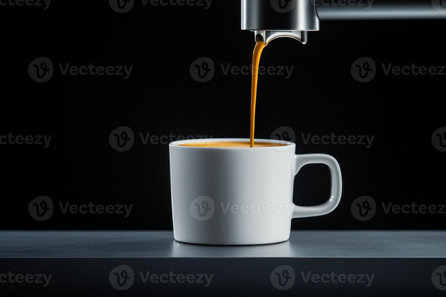 Freshly brewed coffee pours into a white cup on a dark counter in a modern kitchen setting photo