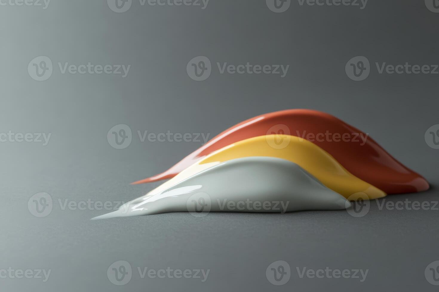 Colorful paint blobs arranged on a smooth surface showcasing vibrant hues and textures in an artistic composition photo