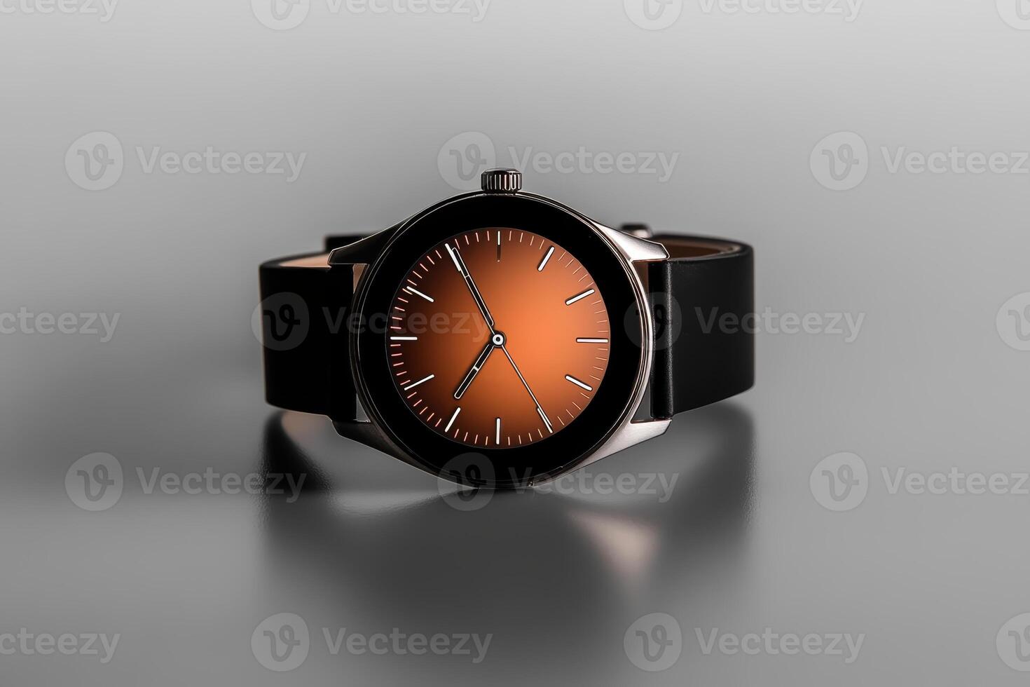 Elegant wristwatch with orange dial and black strap on a reflective surface highlighting its sleek design and craftsmanship photo