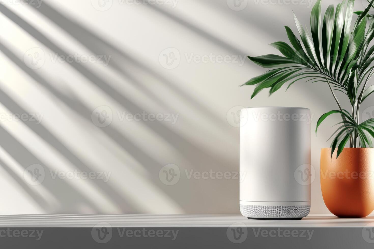 Modern home decor featuring an elegant speaker and a vibrant potted plant in natural light photo