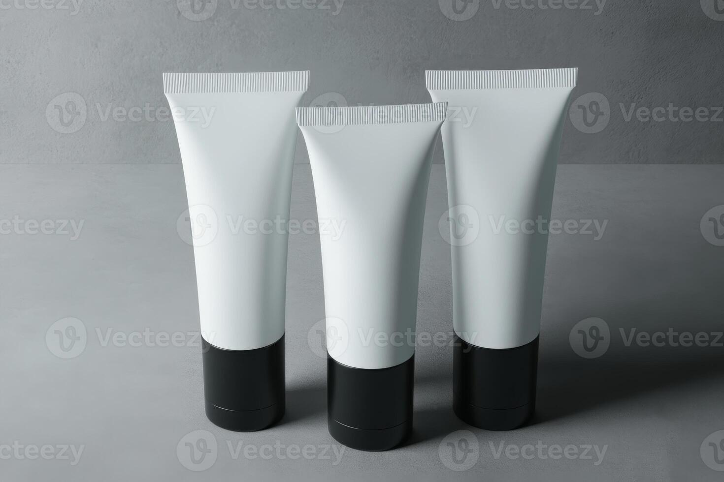 Three minimalist cosmetic tubes arranged on a grey surface showcasing a sleek and modern design photo