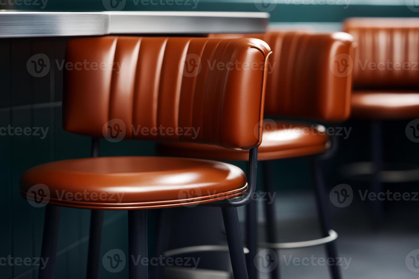 Stylish brown leather bar stools in a modern cafe setting during the day photo