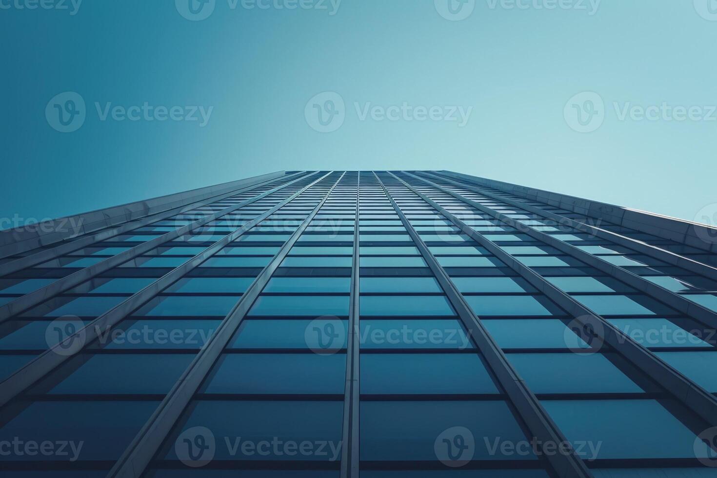 A view of a tall building with windows photo