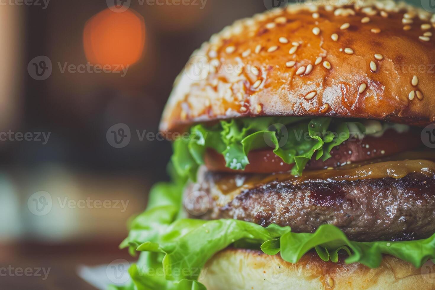 A close up of a hamburger with lettuce and tomato photo