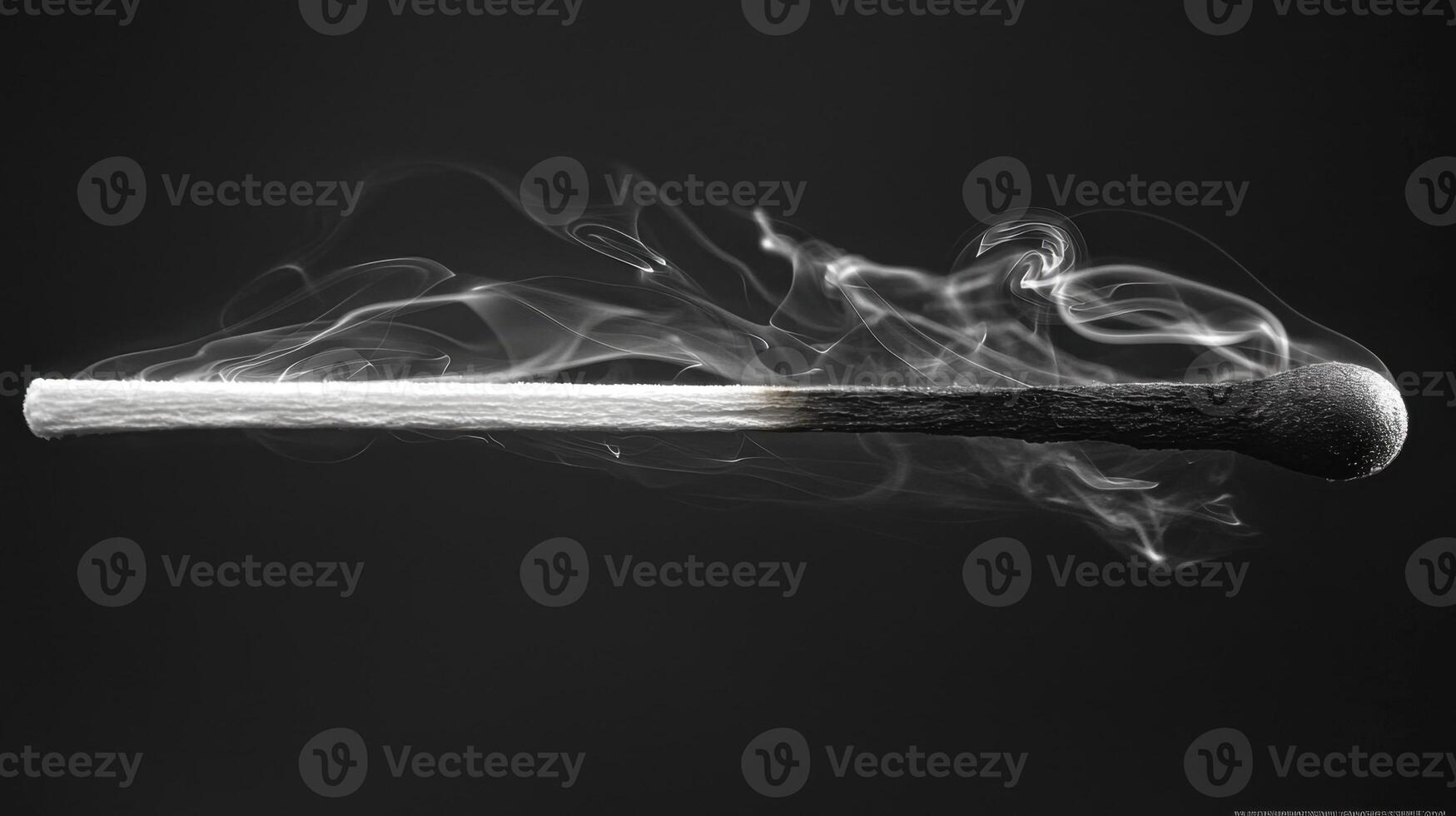 A matchstick with smoke coming out of it photo