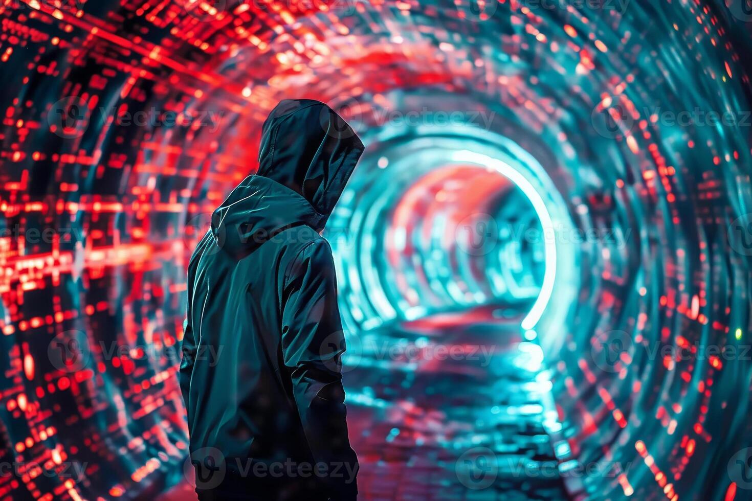 A person in a hoodie standing in a tunnel photo