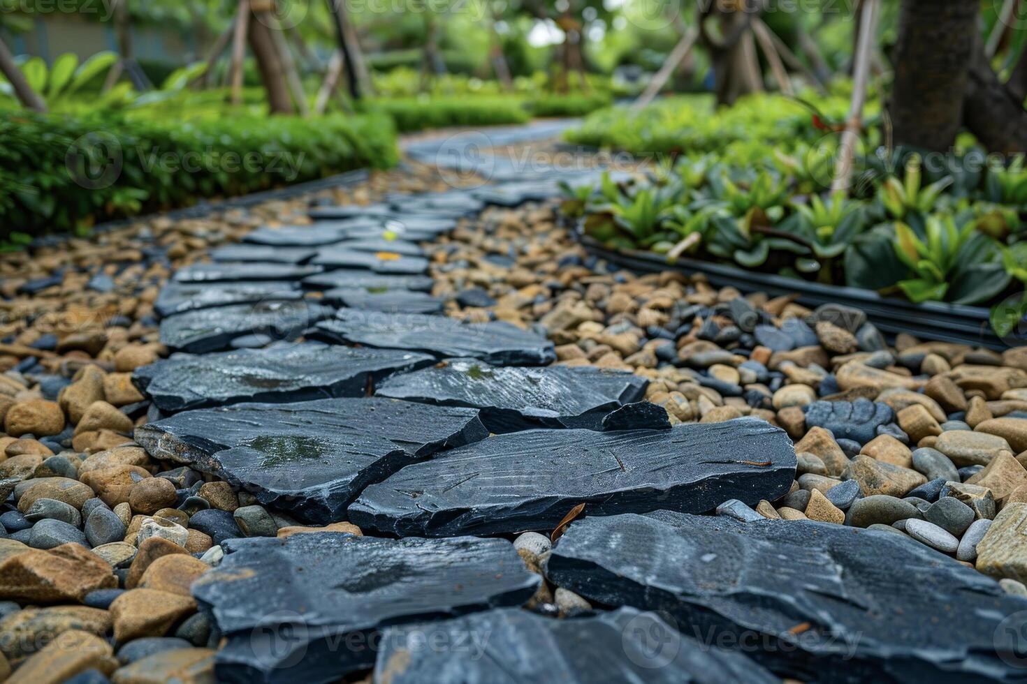A stone path in a garden with rocks and gravel photo