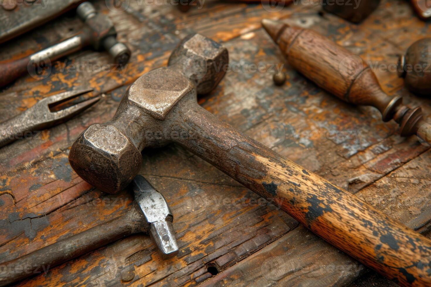 Vintage Hammer Close-Up. Detailed Craftsmanship and Antique Tools on Rustic Wooden Surface photo